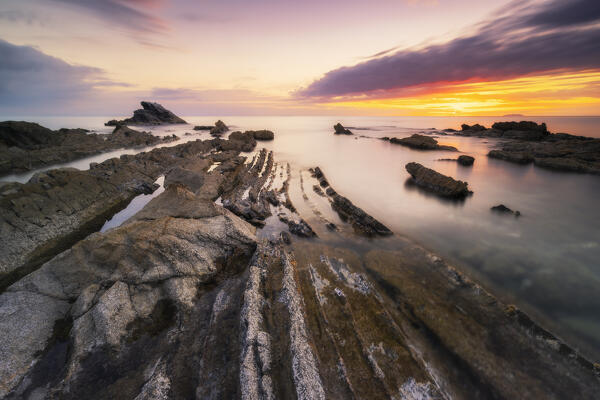 Long exposure at sunset on the coast of Antignano, Livorno province, Tuscany, Italy, Europe
