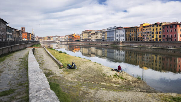 Fisherman on the Lungarno, Arno river, Pisa, Tuscany, Italy, Europe