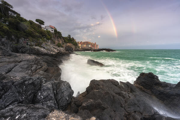 Rainbow and rough sea over the village of Tellaro, municipality of Lerici, La Spezia province, Liguria district, Italy, Europe