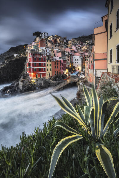 Cloudy evening over the village of Riomaggiore, National Park of Cinque Terre, municipality of Riomaggiore, La Spezia province, Liguria district, Italy, Europe
