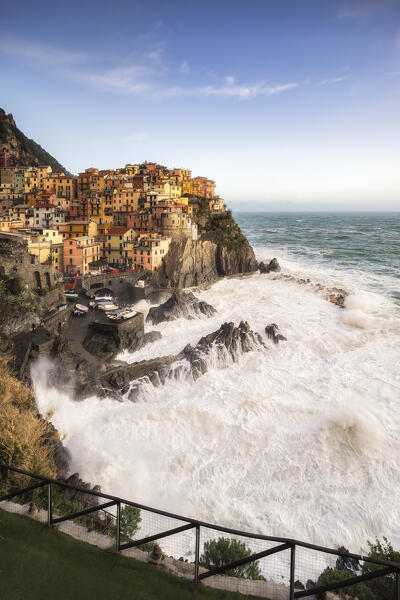 Storm at sunset on the cliff of the village of Manarola, Cinque Terre National Park, municipality of Riomaggiore, La Spezia province, Liguria district, Italy, Europe

