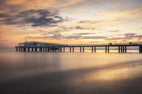 Long exposure at sunset on the pier of Lido di Camaiore, Lucca province, Versilia, Tuscany, Italy, Europe