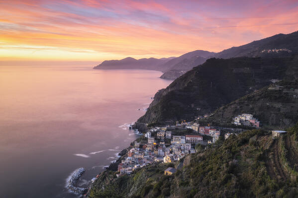 Spectacular sunset over the village of Riomaggiore, National Park of Cinque Terre, municipality of Riomaggiore, La Spezia province, Liguria district, Italy, Europe
