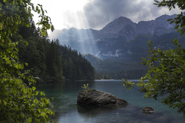 Sun rays over Lake Tovel, Brenta Group, Ville d'Anaunia, Non valley, Trentino, Trento Province, Trentino-Alto Adige, Italy, Europe