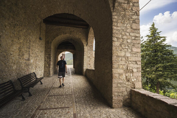 A young man is visiting Vallo di Nera, Perugia province, Umbria, Italy, Europe