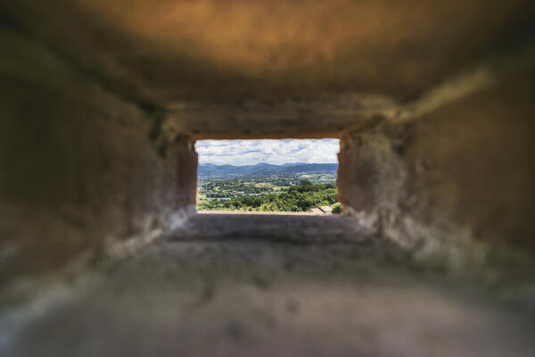 View from an hole in a wall of Narni.
Narni, Terni province, Umbria, Italy, Europe.