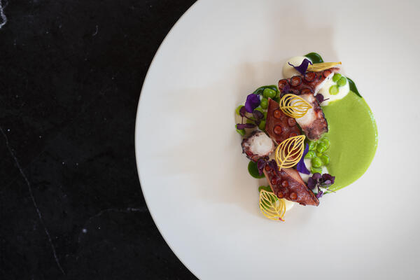 Bbq octopus, peas, crescenza and wild garlic