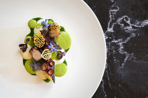 Bbq octopus, peas, crescenza and wild garlic