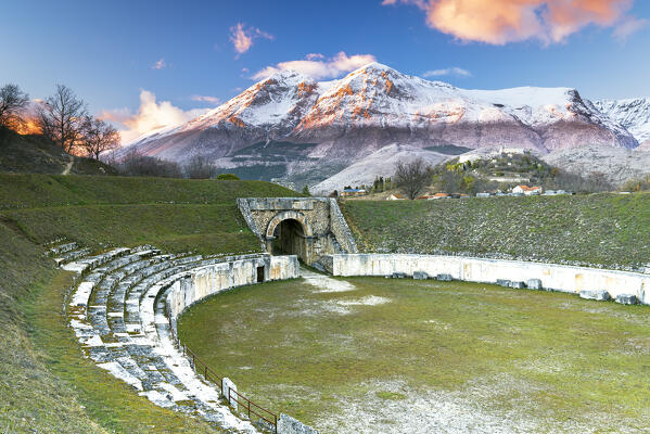Sunset from the amphitheatre of the roman archeological site of Alba Fucens with majestic Apennines mountain of Sirente Velino regional park, Marsica district, L’Aquila province, Abruzzo, Italy
