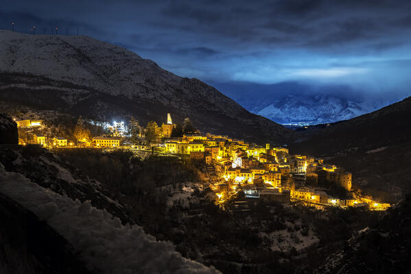 The illuminated village of Anversa degli Abruzzi in a winter evening, L’Aquila province, Abruzzo, Italy