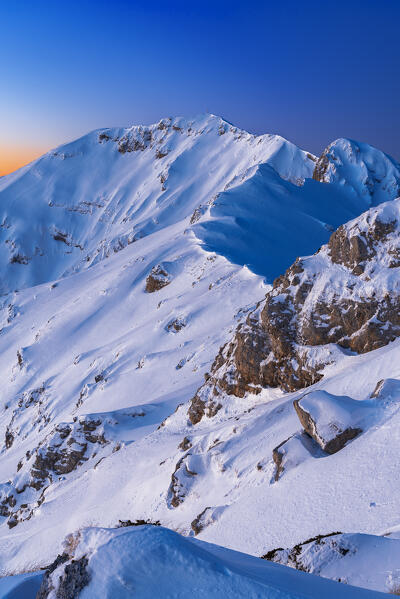 View at dawn of the snowy mountain ridge of Viglio peak, Apennines, Simbruini regional park, Frosinone province, Latium, Italy
