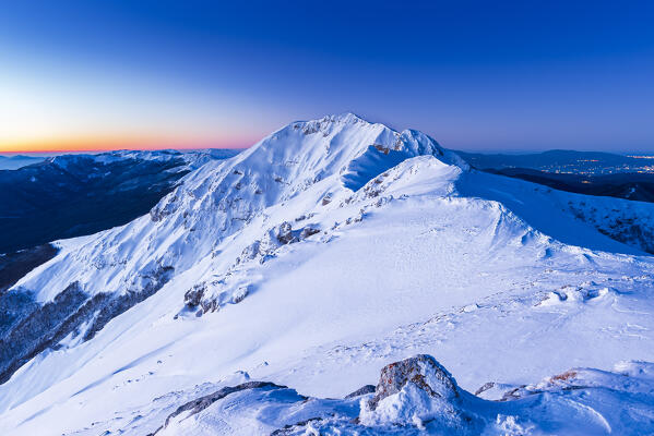 View at dawn of the snowy mountain ridge of Viglio peak, Apennines, Simbruini regional park, Frosinone province, Latium, Italy