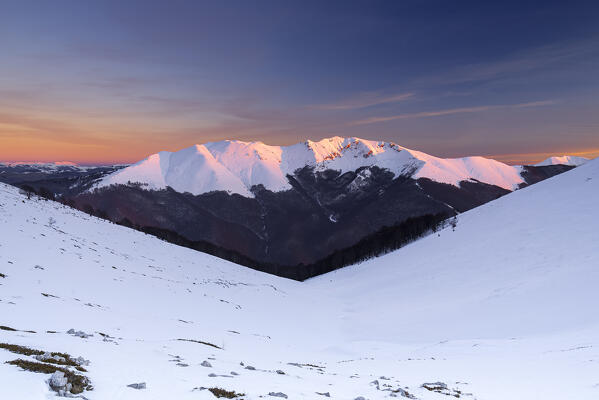 Panoramic view of the snow covered Viglio mountain at the sunset, Apennines, Simbruini regional park, Frosinone province, Latium, Italy