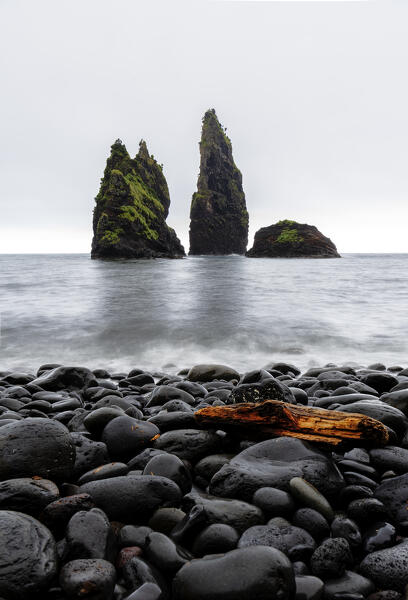 Rock formation and black stone beach of Alagoa bay, Santa Cruz das Flores municipality, Flores Island (Ilha das Flores), Azores archipelago, Portugal, Europe
