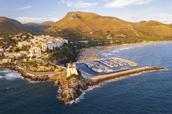 Aerial view of the old sea village of Sperlonga with the tower and the marina surronded by hills and mountains at sunset, Sperlonga, Latina province, Latium, Central Italy, Italy, Europe