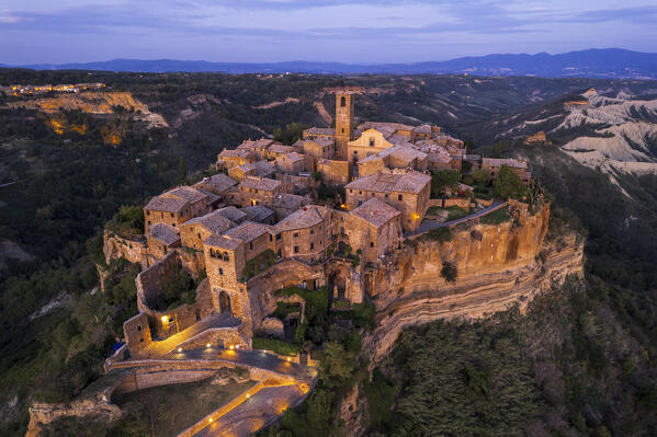 Aerial view of the medieval illuminated village of Civita di Bagnoregio at dusk, Viterbo province, Tuscia, Latium, central Italy, Italy, Southern Europe, Europe