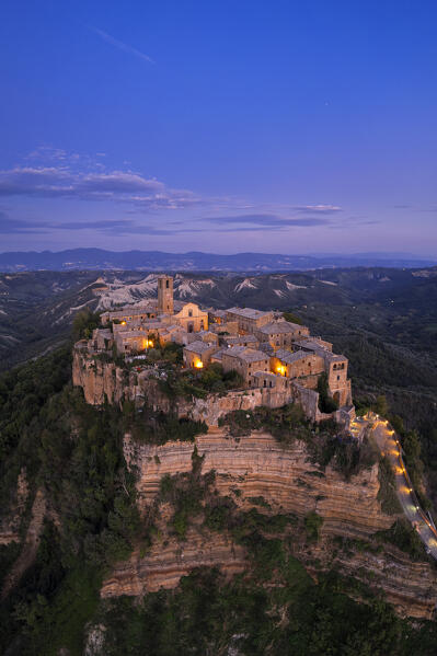 Panoramic aerial view of the medieval illuminated village of Civita di Bagnoregio at dusk, Viterbo province, Tuscia, Latium, central Italy, Italy, Southern Europe, Europe