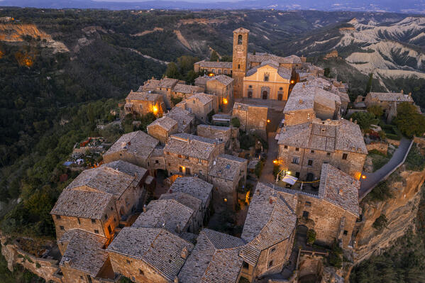 Aerial detail of the medieval village and the church of Civita di Bagnoregio lit from street light at dusk, Viterbo province, Tuscia, Latium, central Italy, Italy, Southern Europe, Europe