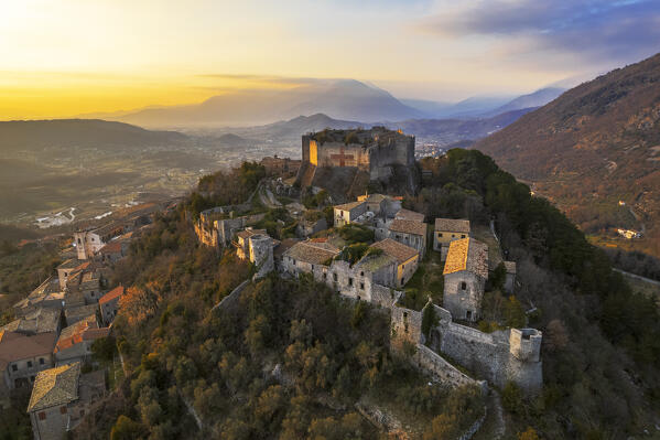 Aerial view of the medieval castle of Vicalvi overlooking the village with red cross painted on the perimetral wall, at sunset, Vicalvi, Frosinone province, Ciociaria, Latium region, Italy, Europe