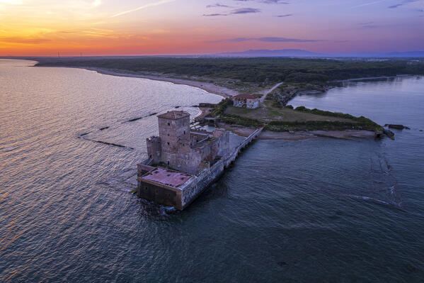 The medieval tower of Torre Astura at sunset, drone view, Nettuno municipality, Rome province, Latium, Tyrrhenian sea, Italy, Europe