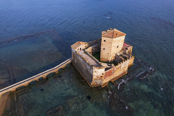 High angle view of the medieval castle of Torre Astura built on roman ruins and surrounded by sea water, sunset view, Nettuno municipality, Rome province, Latium, Tyrrhenian sea, Italy, Europe