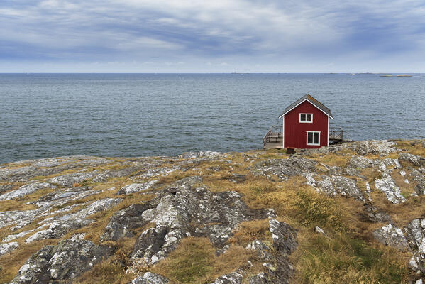 Isolated red house overlooking the ocean, Astol, Tjorn municipality, Vastra Gotaland, West Sweden, Sweden Scandinavia, Europe