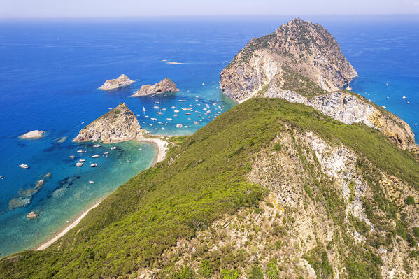 The harsh peaks of the wild island of Palmarola covered with vegetation seen from the drone, Ponza municipality, Pontine archipelago, Latina province, Latium region, Tyrrhenian Sea, Italy, Europe