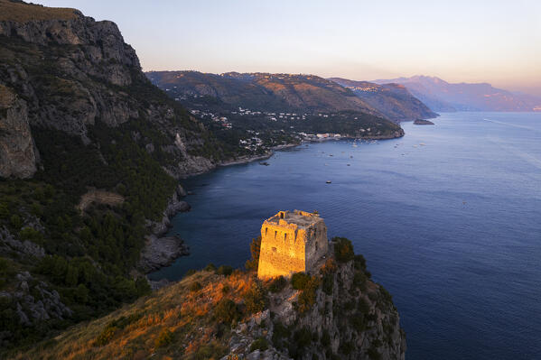 Aerial view of the medieval tower on top of a cliff overlooking Amalfi coast at sunset, Punta Campanella, Ieranto bay, Nerano, Massa Lubrense municipality, Amalfi coast, Naples province, Campania region, Italy