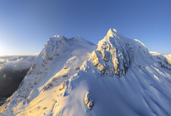 Corno Grande and Corno piccolo covered with snow at sunrise, aerial view, Gran Sasso e Monti della Laga national park, Pietracamela, Teramo, Abruzzo, Apennines, Italy