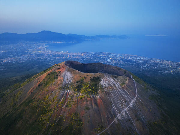 Drone picture of volcano Vesuvio (Vesuvius) and Naples bay seen at dusk, Vesuvius National Park, Naples, Campania, South of Italy, Italy