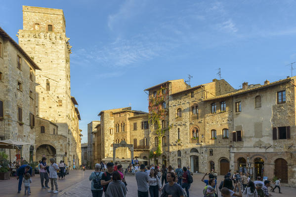 Tourists in the square of San Gimignano. Italy, Tuscany, Siena district.