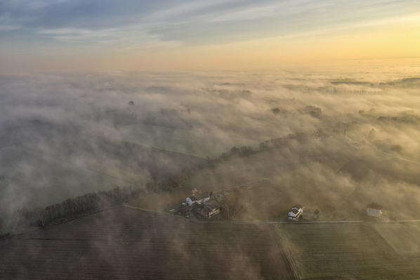 Aerial view of Pianura Padana (Po Valley) at sunrise with fog, Alessandria province, Piedmont, Italy, Europe. 