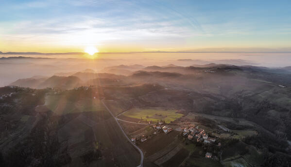 Panoramic aerial view of Alessandria hills with fog, Alessandria province, Piedmont, Italy, Europe. 