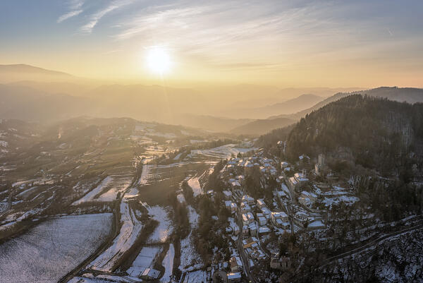 Winter aerial view of the town of Pietragavina and its castle. Pietravina, Varzi, Oltrepo wine region, Oltrepo pavese, Lombardy, Italy, Europe.
