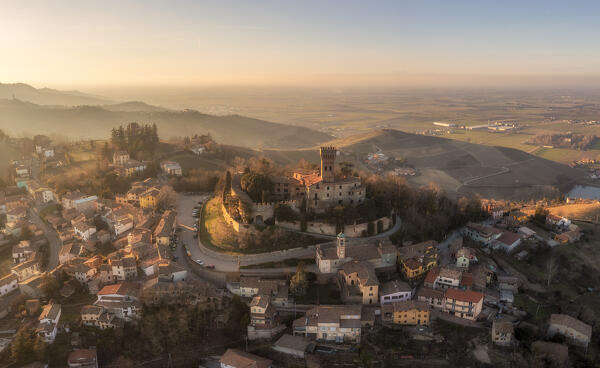 Aerial view of the town of Cigognola and its castle. Cigognola, Oltrepo wine region, Oltrepo pavese, Lombardy, Italy, Europe.
