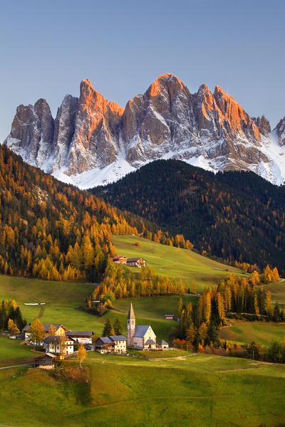Val di Funes, Dolomites, Italy. Santa Maddalena village in autumn with last light of sunset