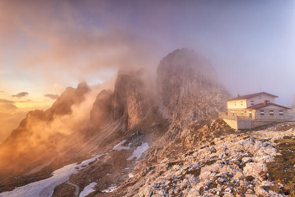 The refuge Fonda Savio in the Cadini mountain group at sunset. Cadini di Misurina, Belluno, Veneto, Dolomiti, Italy.