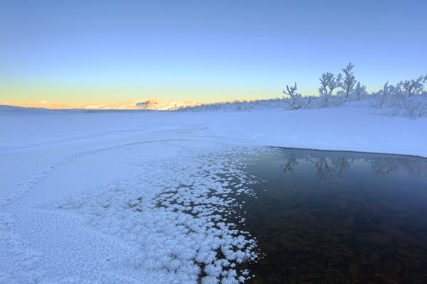 Sunrise on the frozen river, Abisko, Kiruna Municipality, Norrbotten County, Lapland, Sweden