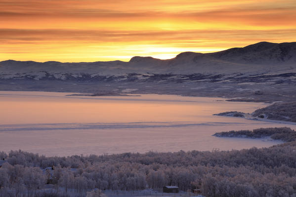 Sunrise on the snowy landscape, Bjorkliden, Abisko, Kiruna Municipality, Norrbotten County, Lapland, Sweden