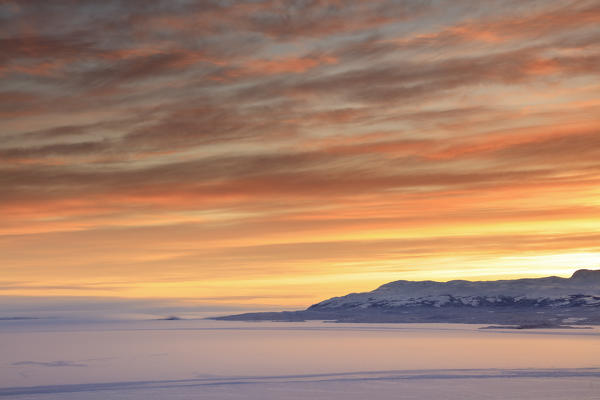 Sunrise on the snowy landscape, Bjorkliden, Abisko, Kiruna Municipality, Norrbotten County, Lapland, Sweden