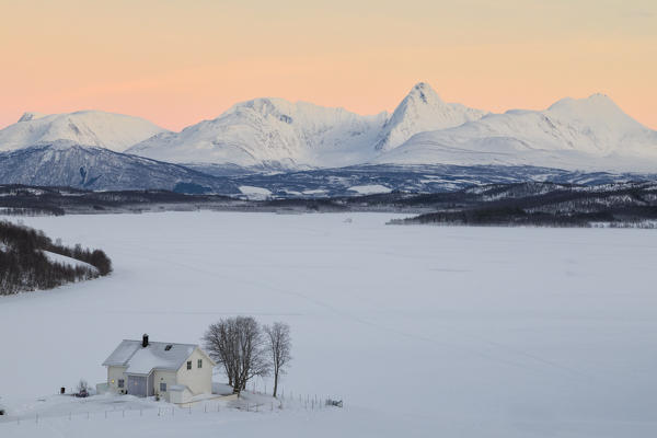 Typical house with Lyngen Alps, Mestervik, Troms county, Norway.