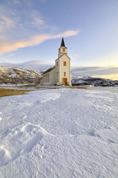 Typical church with Lyngen Alps, Mestervik, Troms county, Norway.