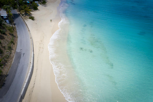 Idyllic tropical Turners beach with white sand, turquoise ocean water and blue sky at Antigua island in Caribbean