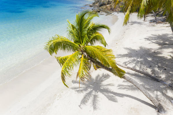 Idyllic tropical Carlisle bay beach with white sand, turquoise ocean water and blue sky at Antigua island in Caribbean 