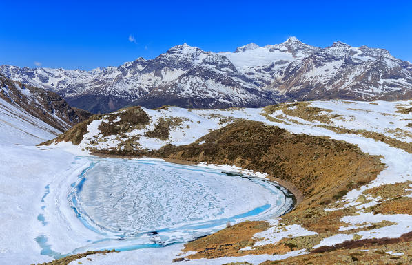 Lake of Two melting as spring arrives, Val Poschiavo, Switzerland