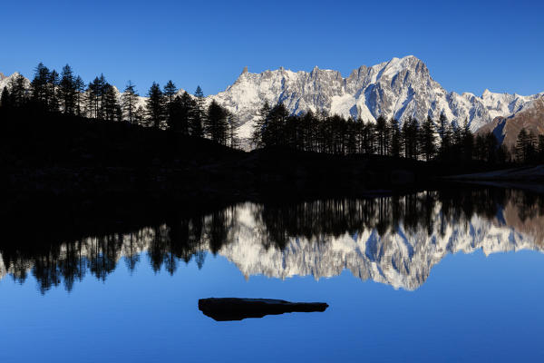 Gran Jorasses reflects in Arpy lake, Mont Blanc range, Aosta valley, italy, europe