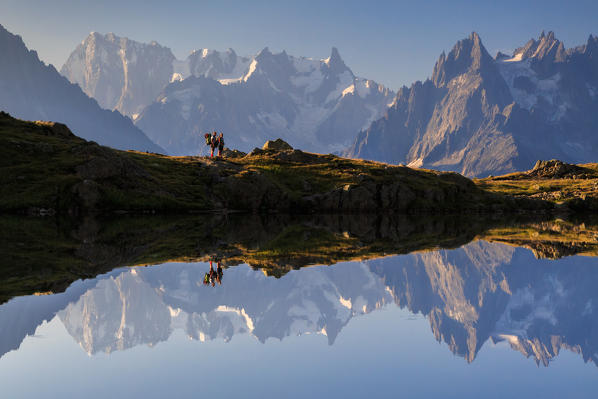 Two hikers on the Cheserys's lake, chamonix, france, europe