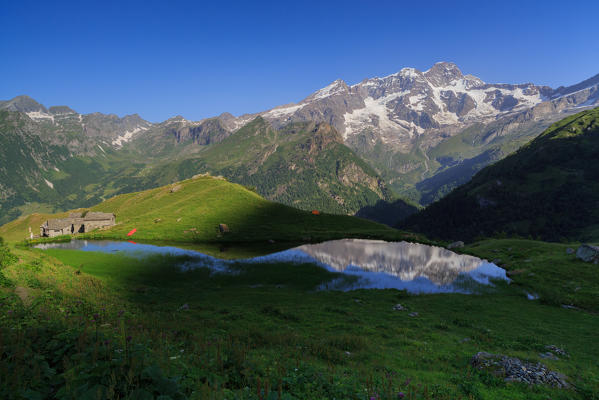 Monte Rosa reflecting in the Alpe Campo Lake,valle d'Aosta, Italy