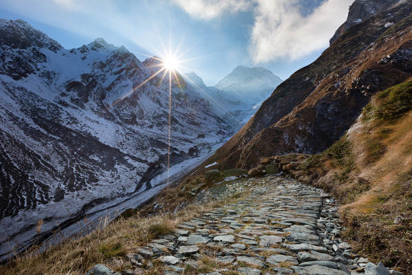 Ancient Roman roads from Casaccia towards Septimerpass - Pass da Sett in Val Maroz in winter at sunset,  Val Bregaglia, Canton Grisons, Switzerland, Europe