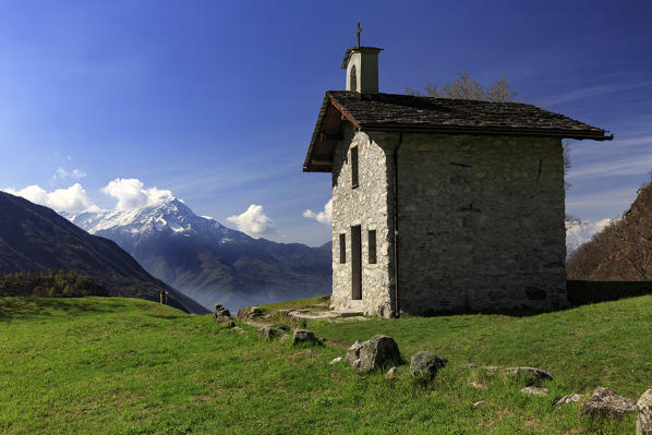 Little alpine church at Avede village in Val Codera with Monte Legnone mountain in background, Valchiavenna, Province of Sondrio, Lombardy, Italy
